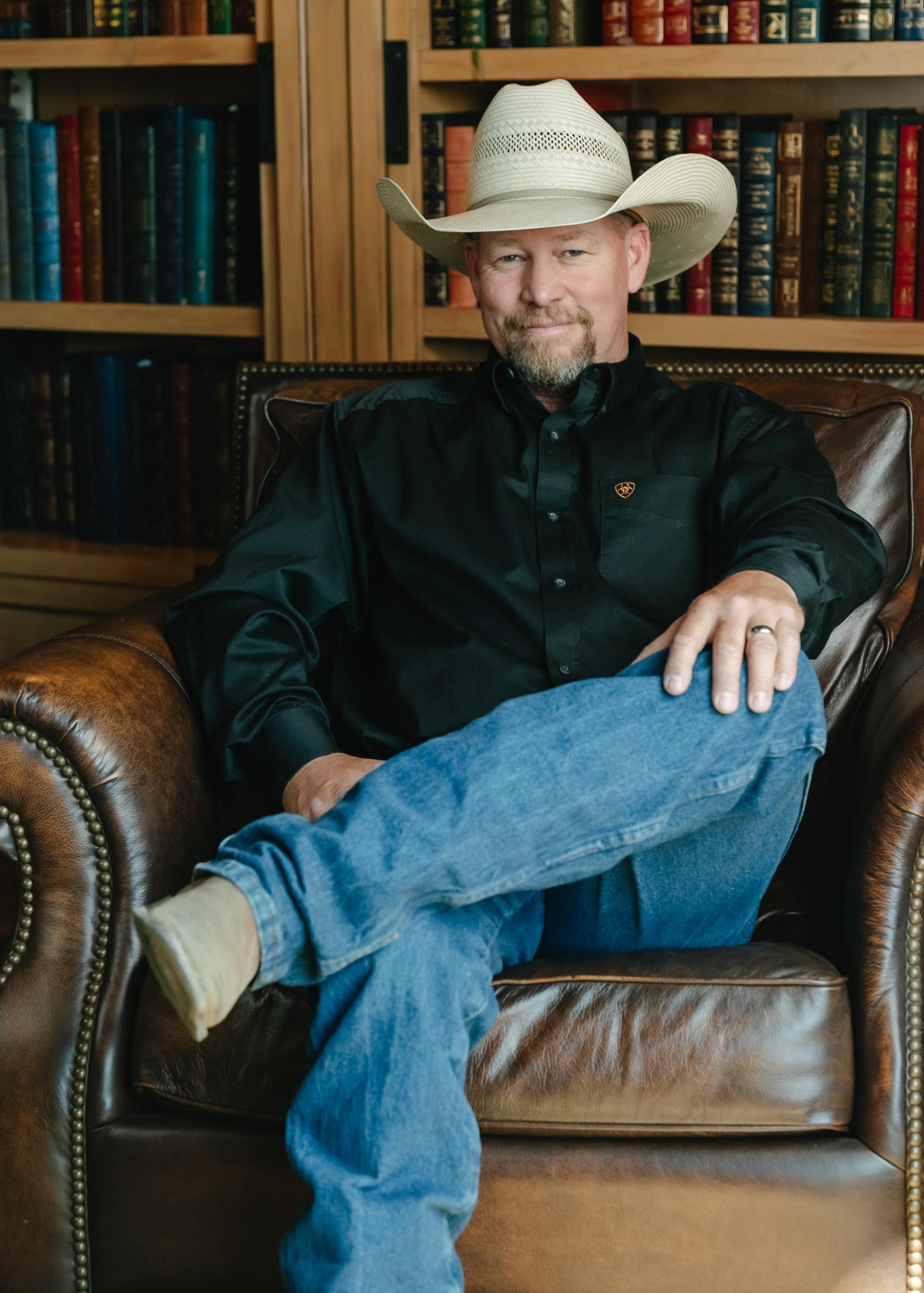 Matt Cook Sitting in a chair Rural Real Estate Agent Southern Oregon Photo